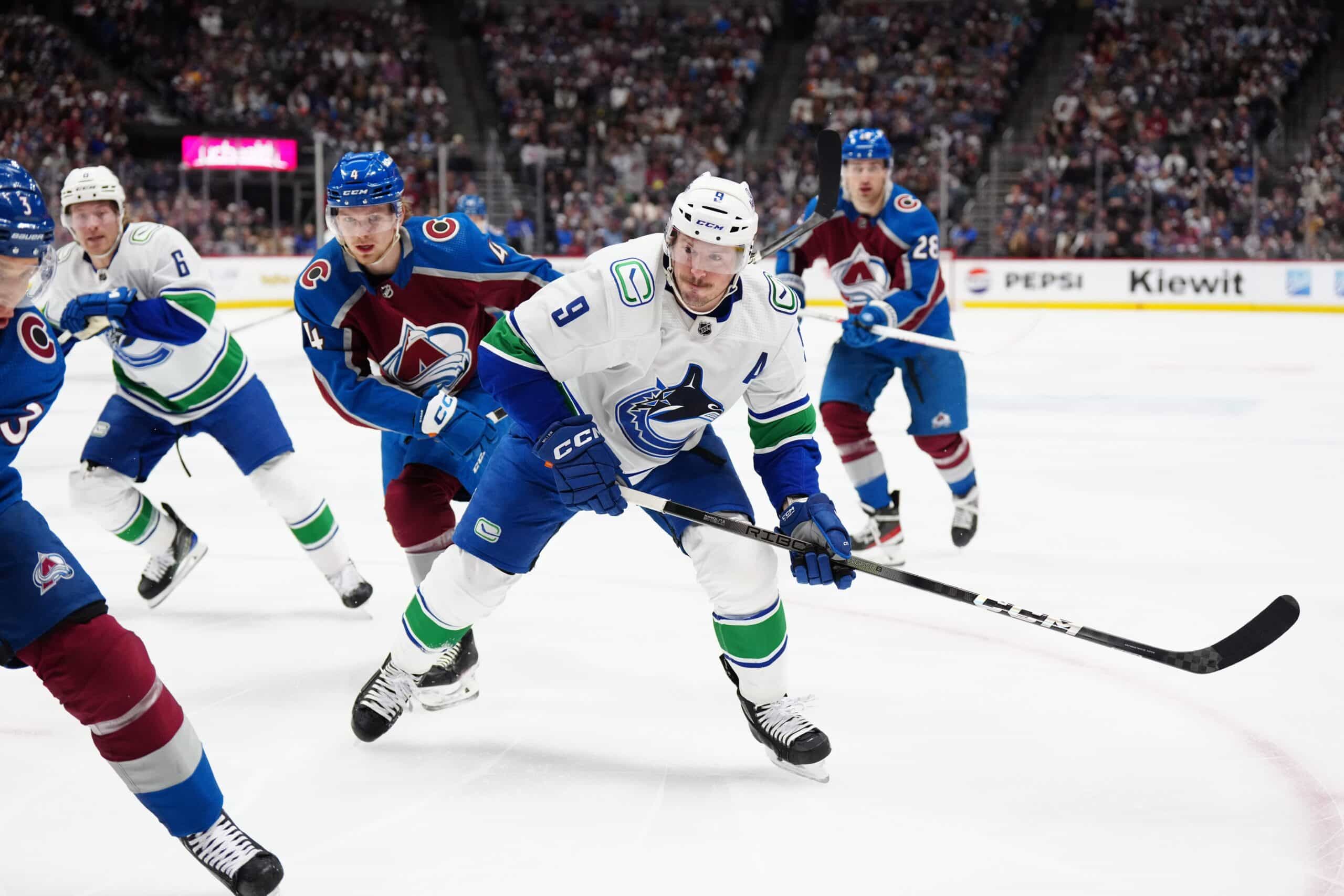 Vancouver Canucks center J.T. Miller and Colorado Avalanche defenseman Bowen Byram.