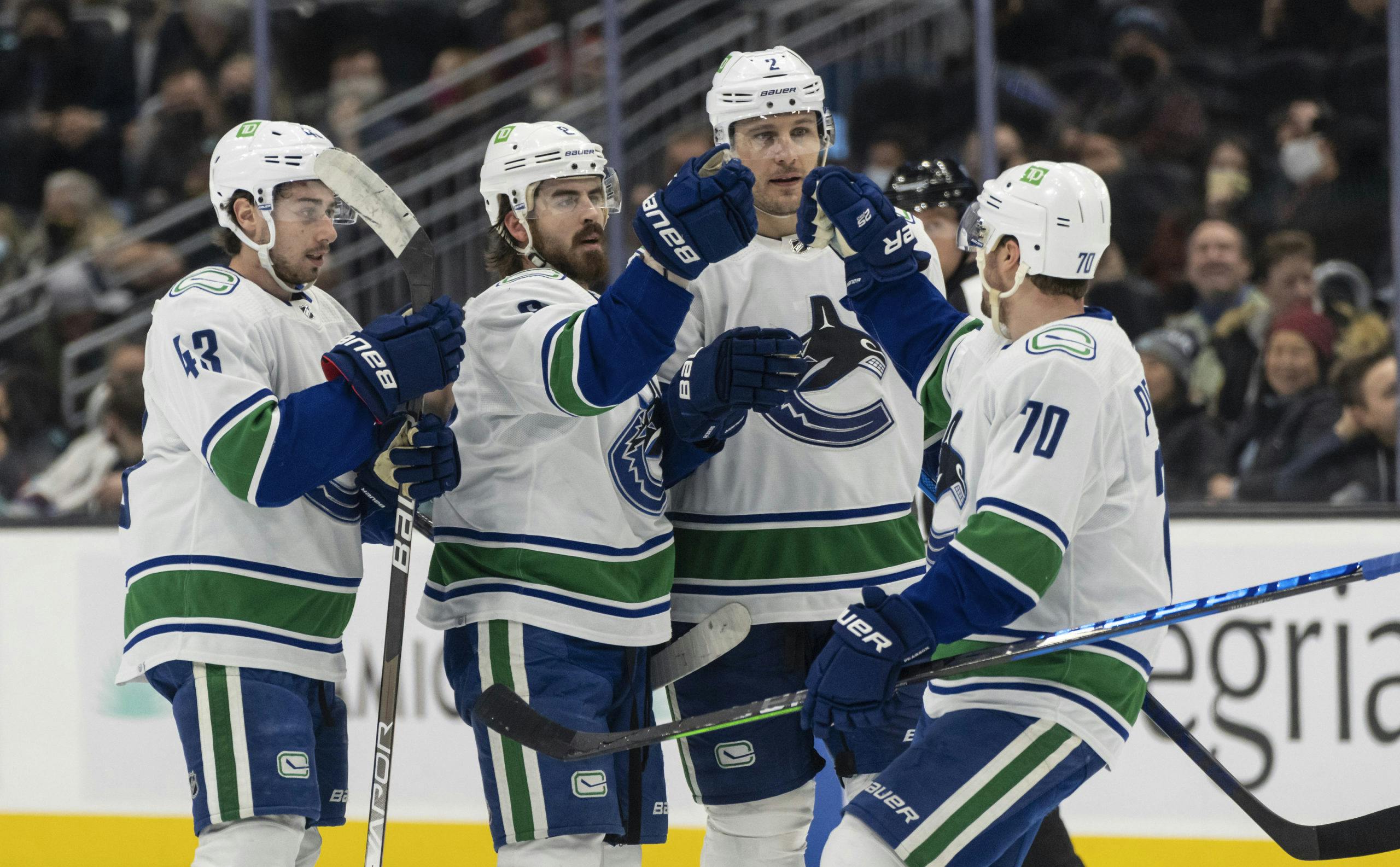 Which players who have played for both Canucks and New Jersey