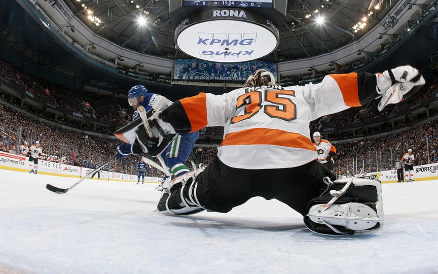 Steve Mason makes a first period save on Chris Higgins.