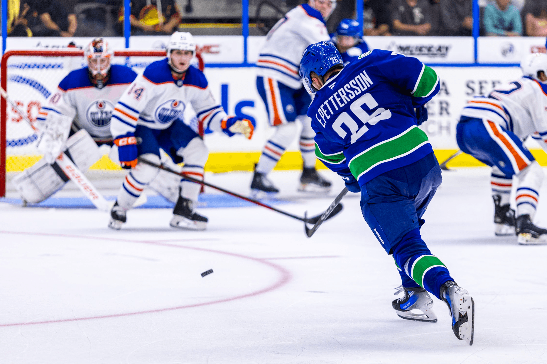 Elias Pettersson shoots the puck at the 2024 Young Stars Classic Vancouver Canucks vs. Edmonton Oilers game