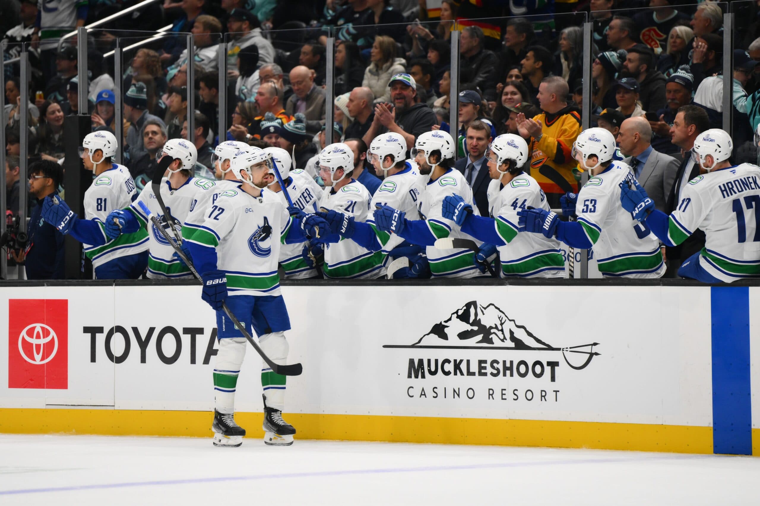 Vancouver Canucks center Filip Chytil (72) celebrates with the bench after scoring a goal against the Seattle Kraken during the first period at Climate Pledge Arena.